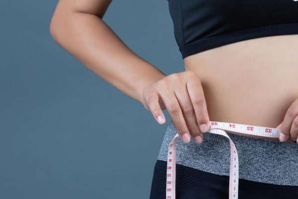 Combating obesity among adolescents – The Hindu Women sportswear hold waist line.jpg