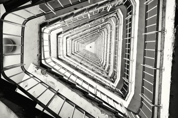 Vertical grayscale shot staircase building.jpg
