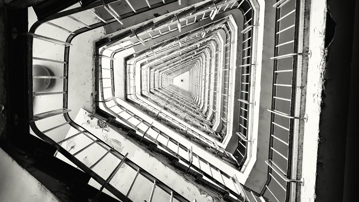 Vertical grayscale shot staircase building.jpg